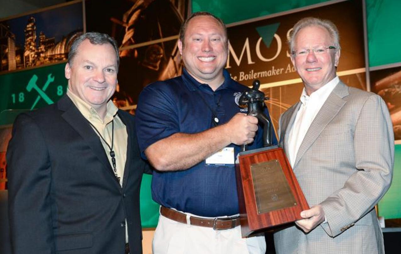 Birmingham, Alabama, Local 108 BM-ST Tim Simmons accepts the Charles W. Jones Award on behalf of his lodge. Left to right, IVP-SE Warren Fairley, Simmons, and IP Newton Jones.